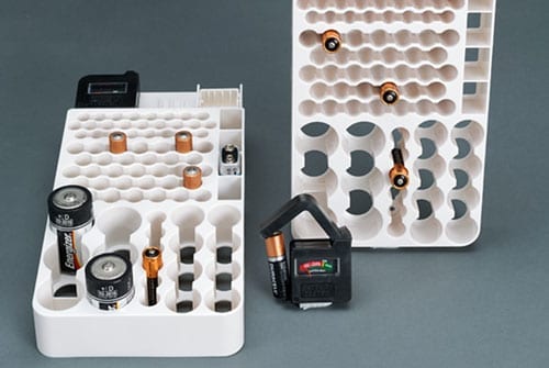 photo of white battery rack and tester distributed by the idm group